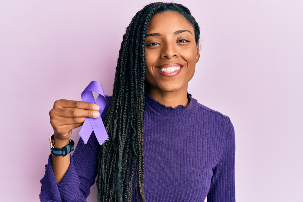 woman holding lupus awareness ribbon