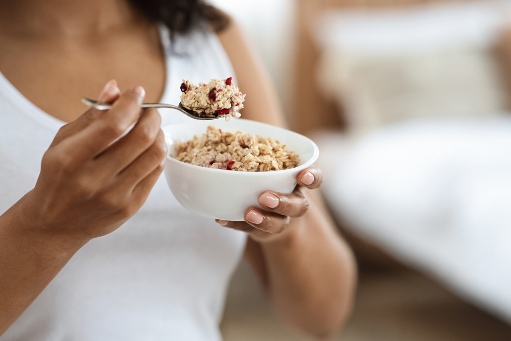 woman eating breakfast oatmeal