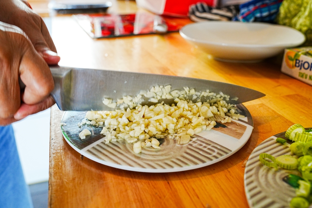 woman cutting garlic